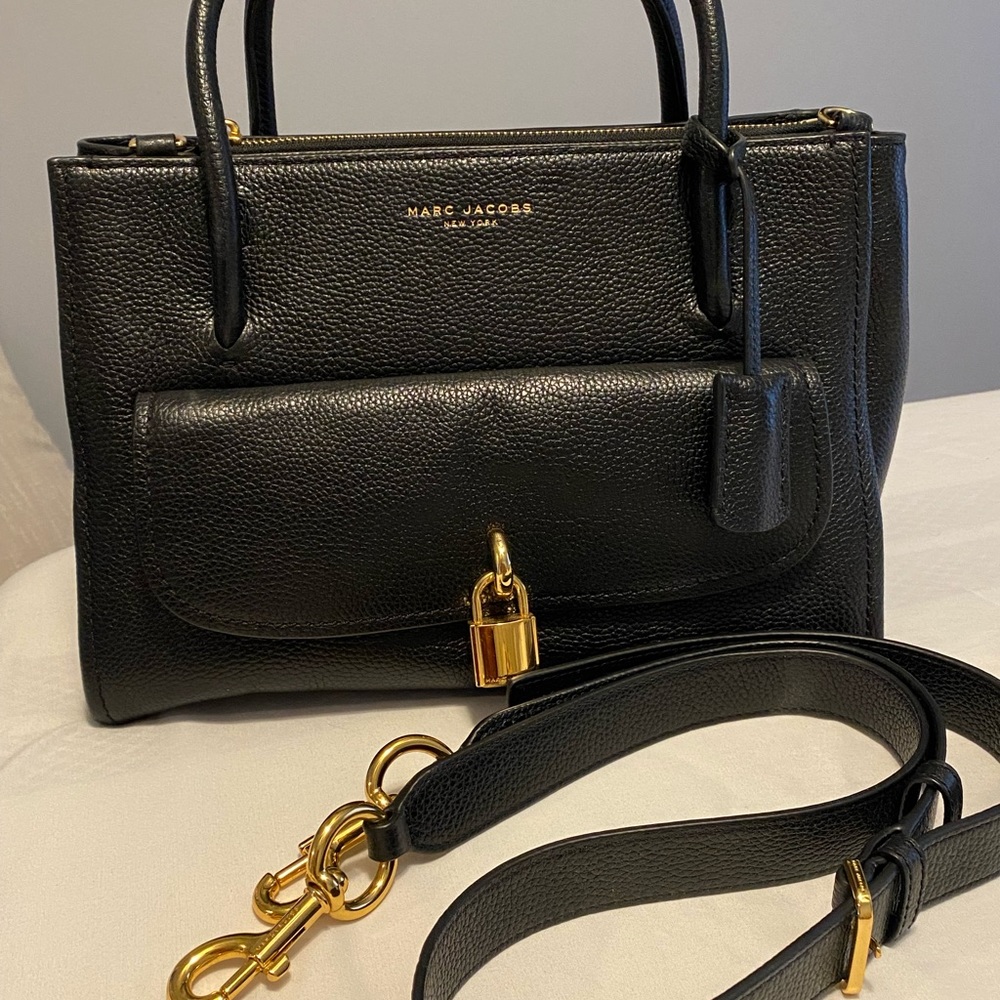 Black leather crossbody or hand bag . Never used